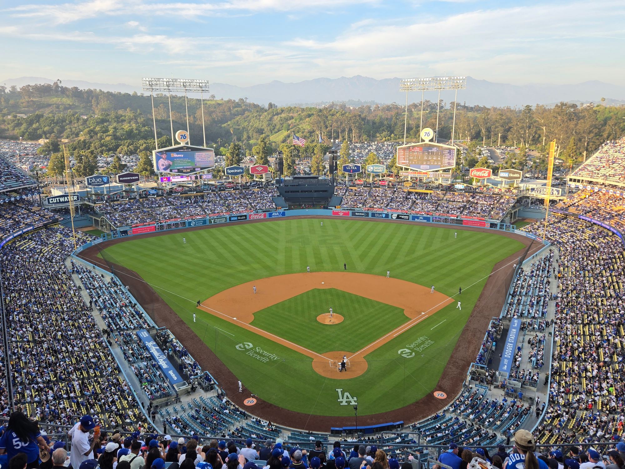 The field at Dodger Stadium from the upper deck behind home plate, with the San Gabriel Mountains beyond the outfield