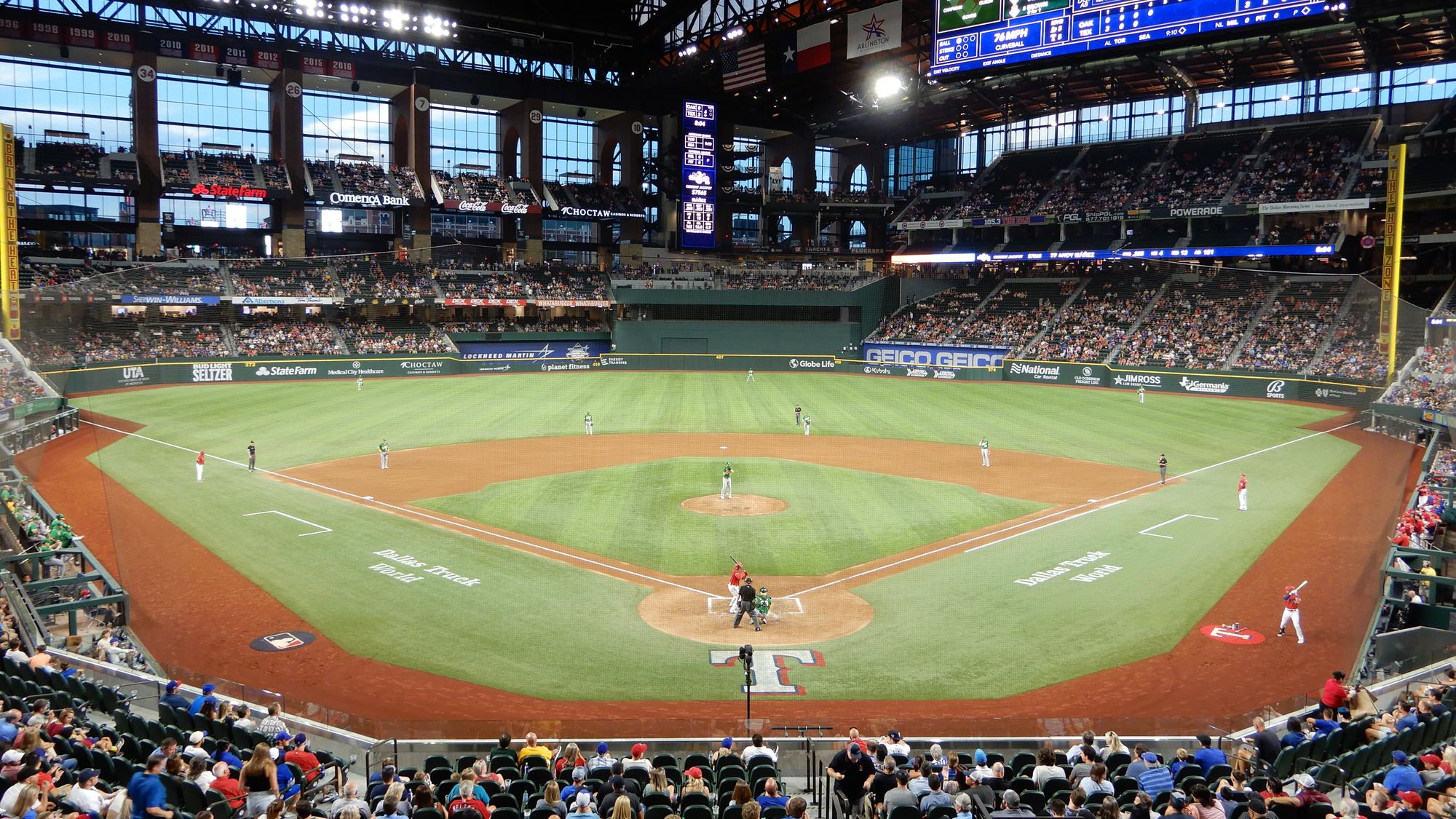 The field at Globe Life Field from the lower seats behind home plate during a game, under the closed roof