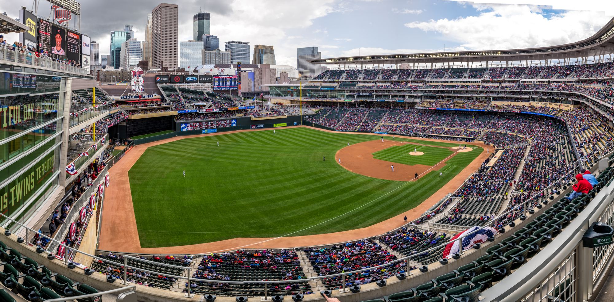 The field at Target Field from the upper deck, with the downtown Minneapolis skyline beyond the outfield